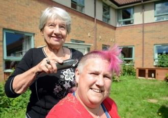 Care home manager shaves head for sensory funds